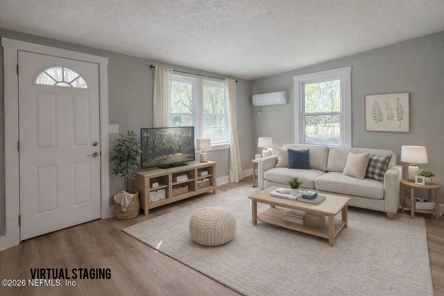 6304 Blanchard Road Jacksonville, FL 32216 - Photo 5 of 15 a living room with furniture and a flat screen tv
