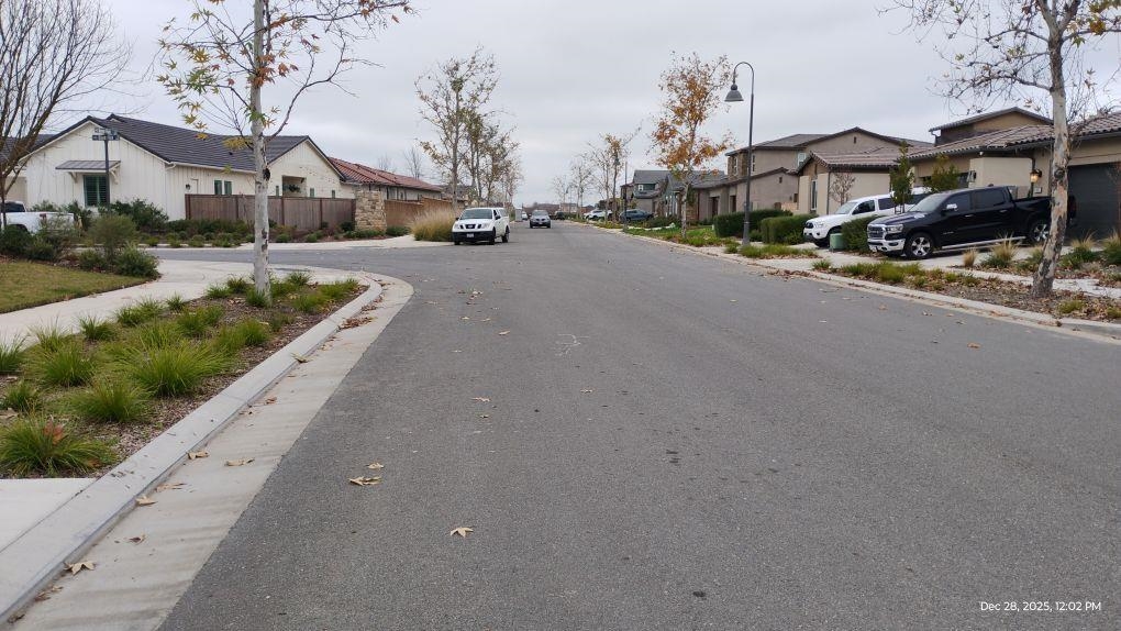 965 Beaver Pond Loop Madera, CA 93636 - Photo 5 of 5 a view of a street with houses