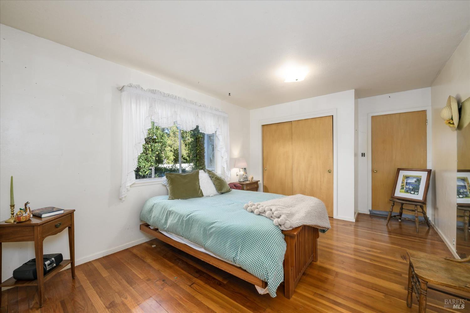 5430 Putah Creek Road Winters, CA 95694 - Photo 17 of 99 a bedroom with a bed and wooden floor
