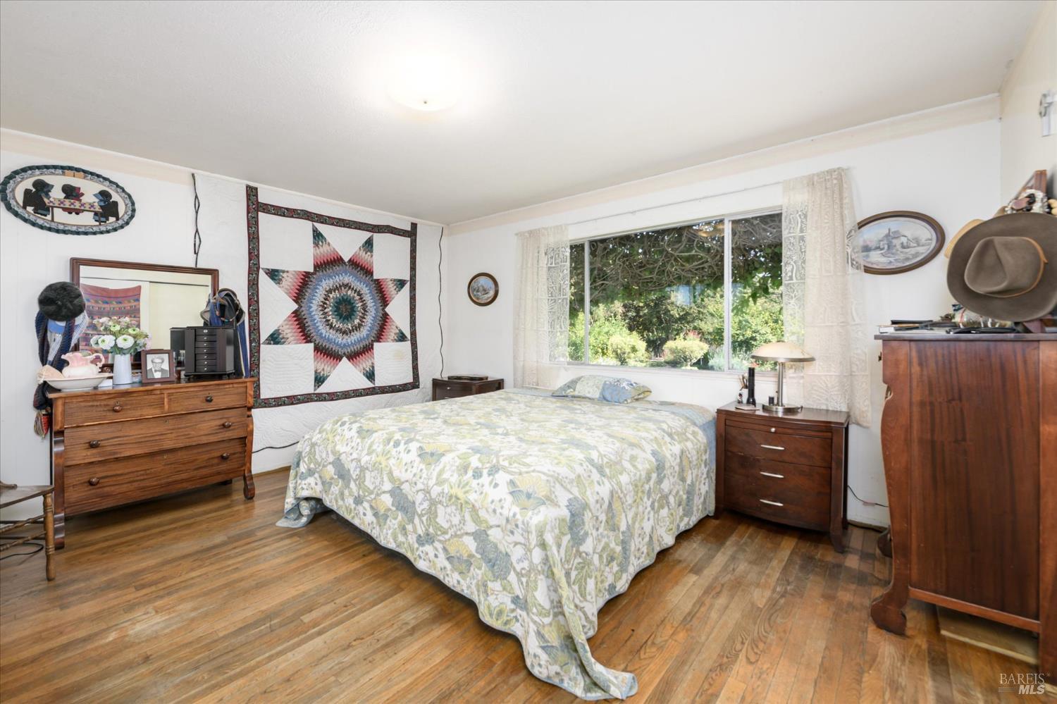 5430 Putah Creek Road Winters, CA 95694 - Photo 19 of 99 a bedroom with a bed and wooden floor