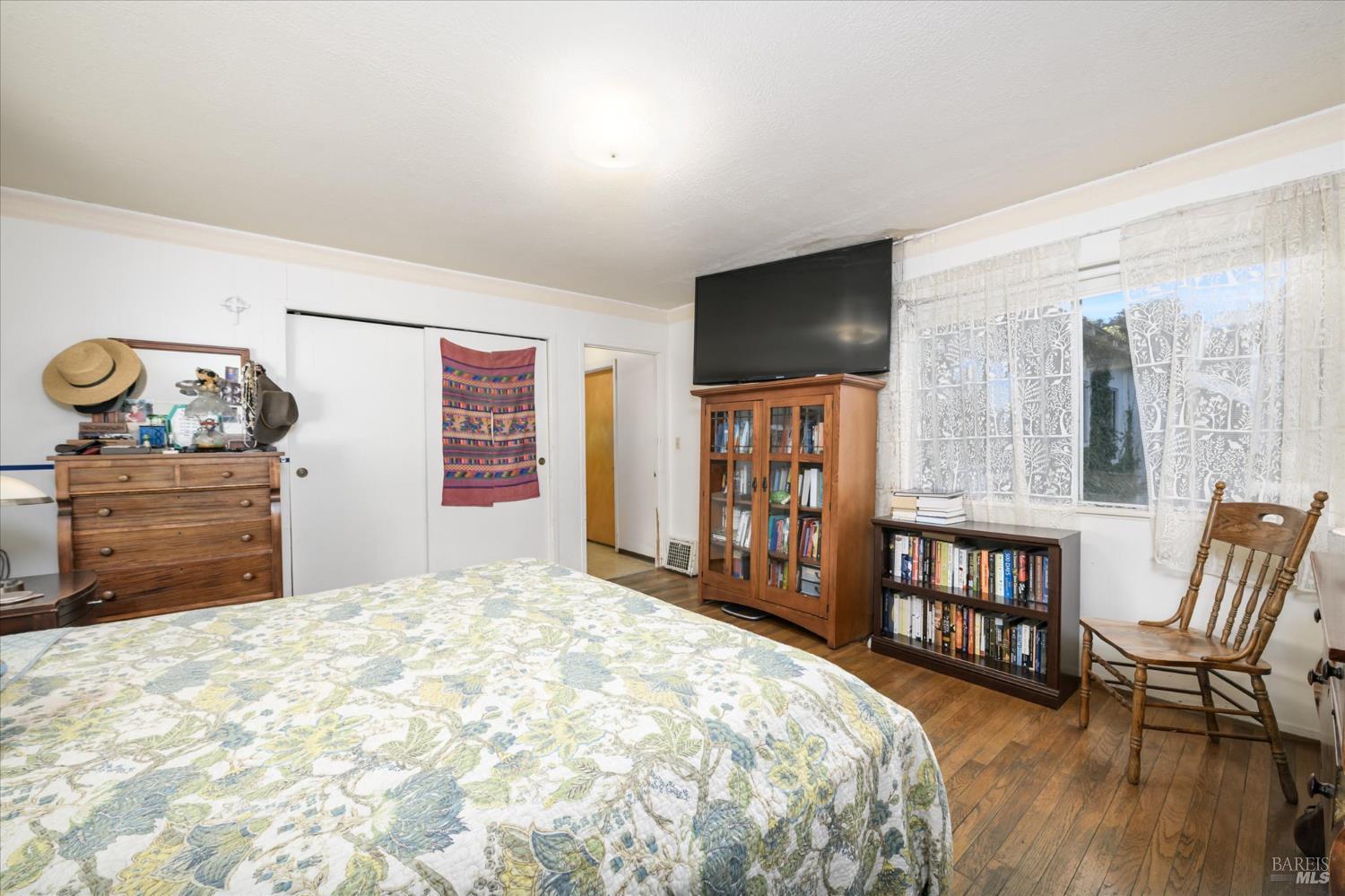 5430 Putah Creek Road Winters, CA 95694 - Photo 20 of 99 a bedroom with a bed a flat screen tv and dresser