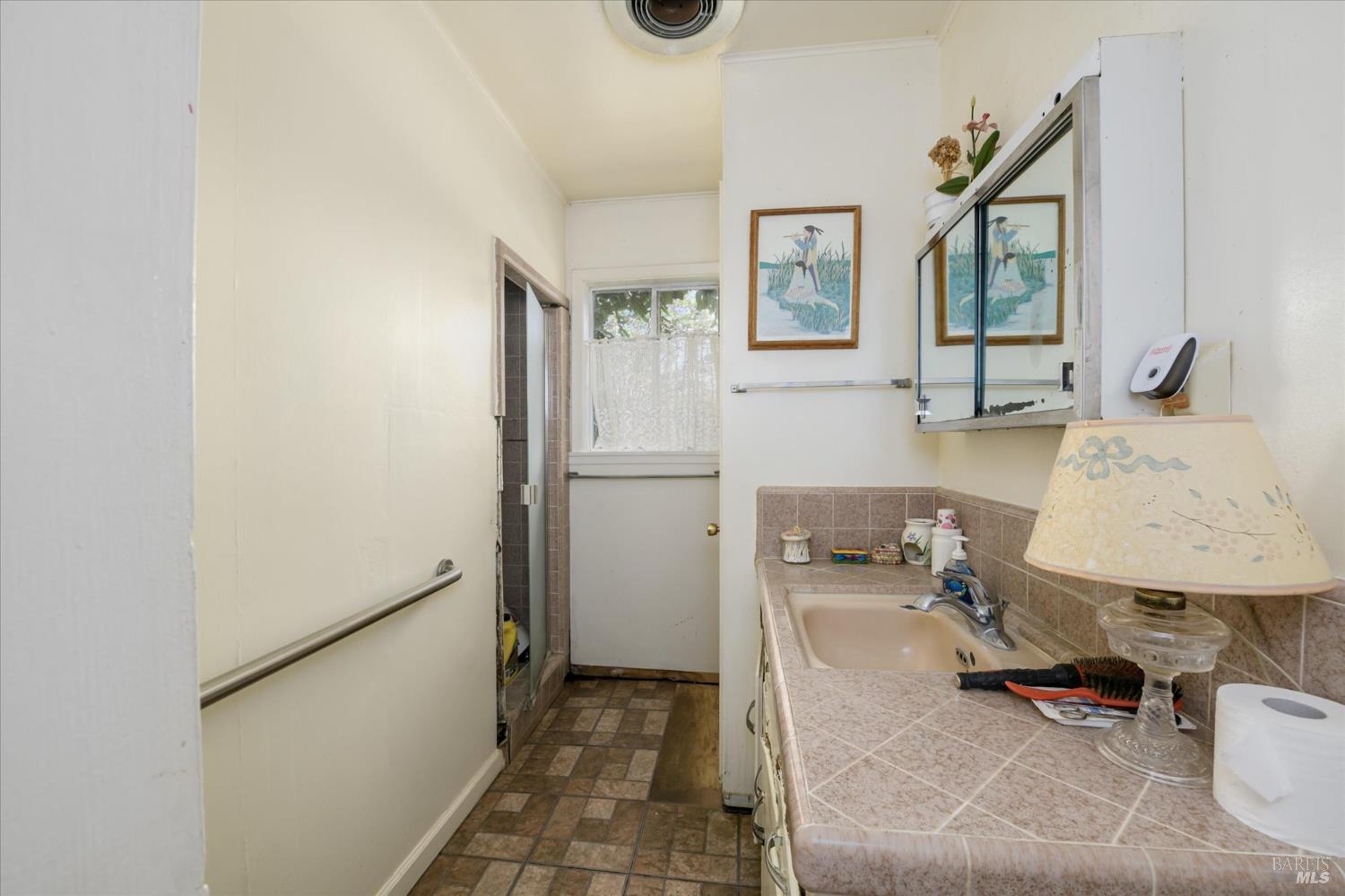 5430 Putah Creek Road Winters, CA 95694 - Photo 22 of 99 a bathroom with a sink toilet and mirror