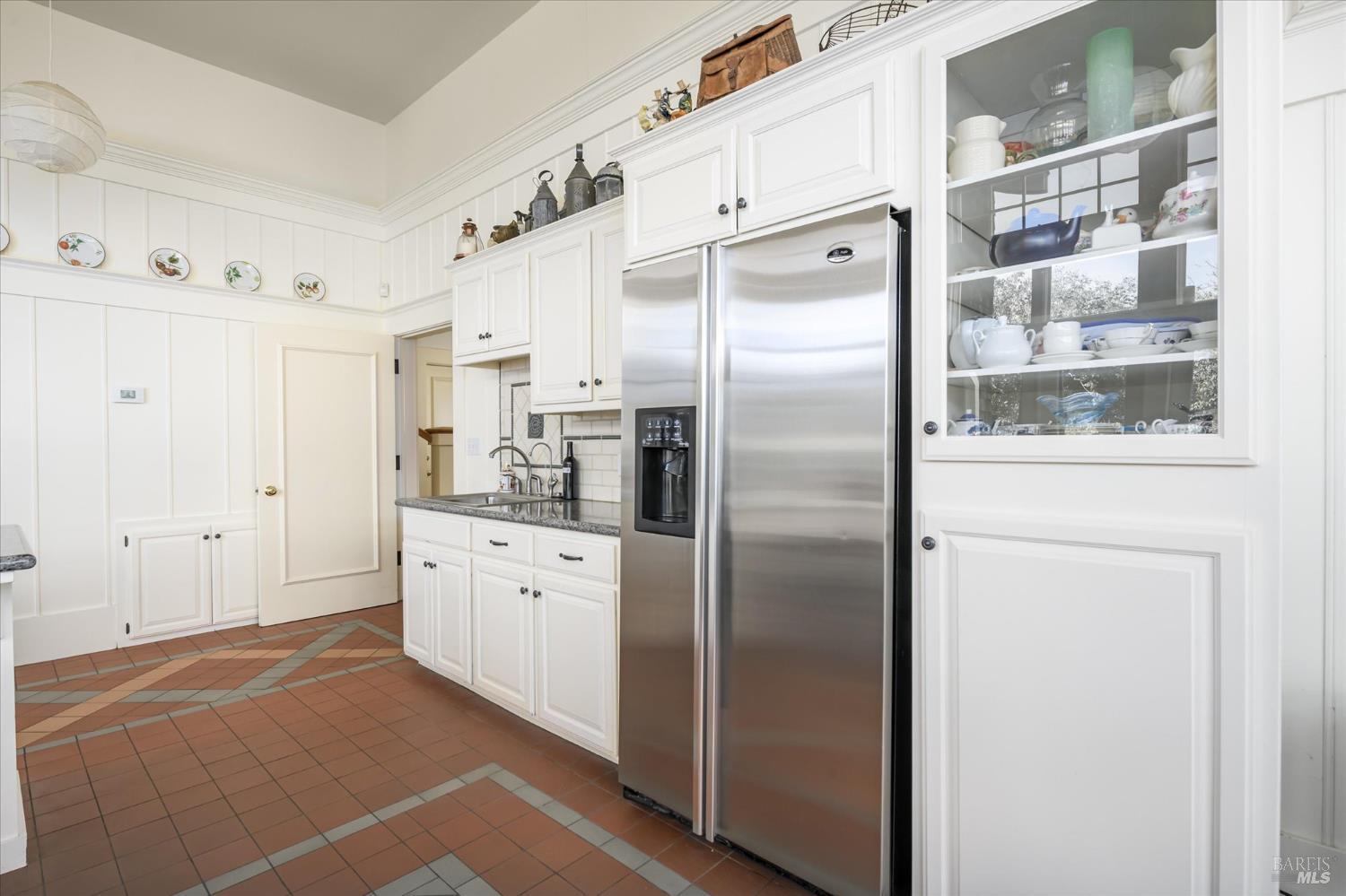 5430 Putah Creek Road Winters, CA 95694 - Photo 34 of 99 a kitchen with stainless steel appliances a refrigerator sink and cabinets