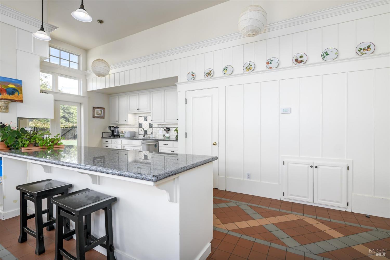 5430 Putah Creek Road Winters, CA 95694 - Photo 35 of 99 a kitchen with stainless steel appliances granite countertop a sink and a white cabinets