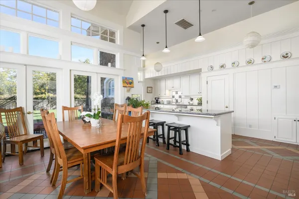 a bathroom with a toilet and a shower curtain