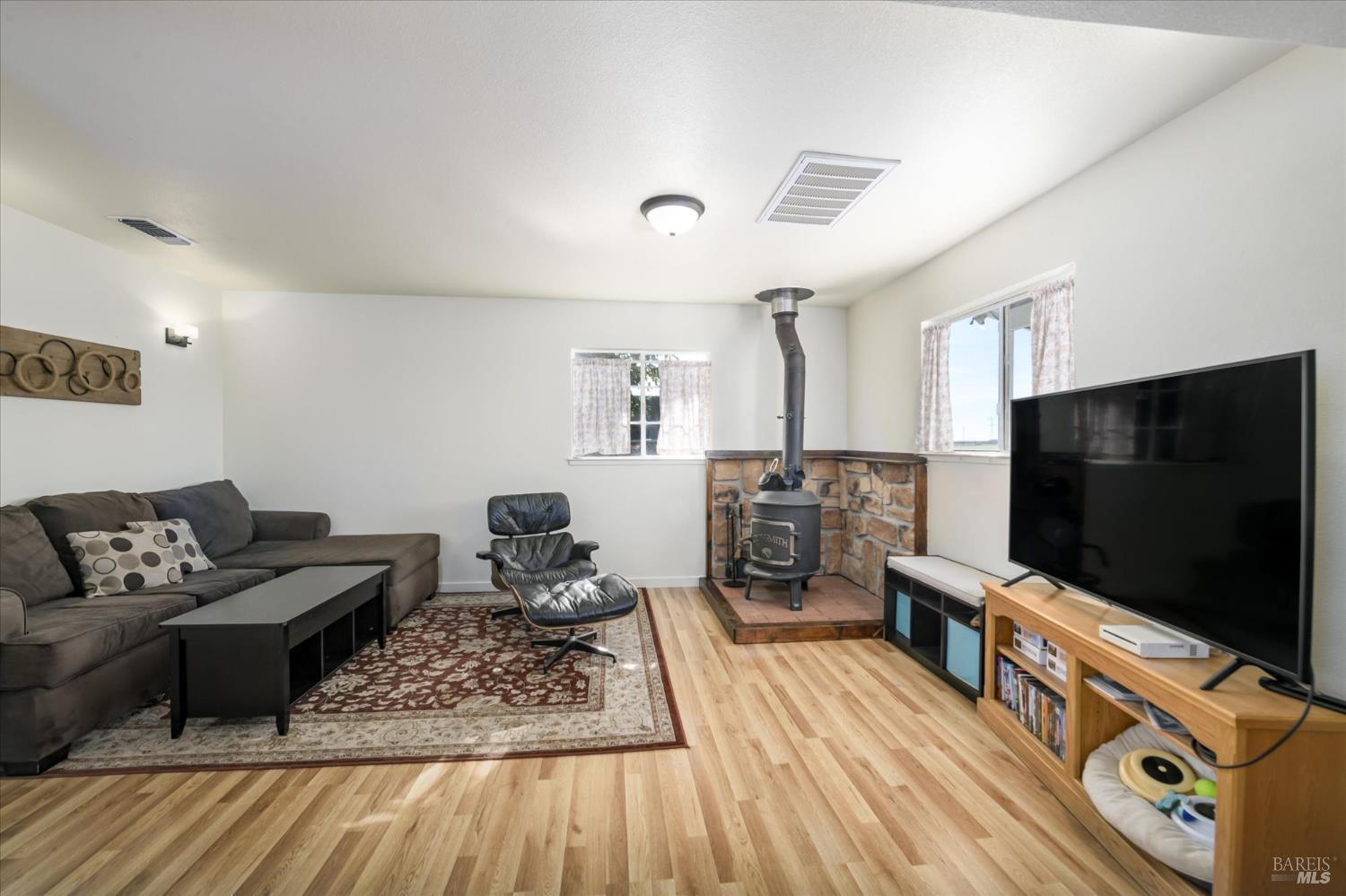5430 Putah Creek Road Winters, CA 95694 - Photo 51 of 99 a living room with furniture and a flat screen tv