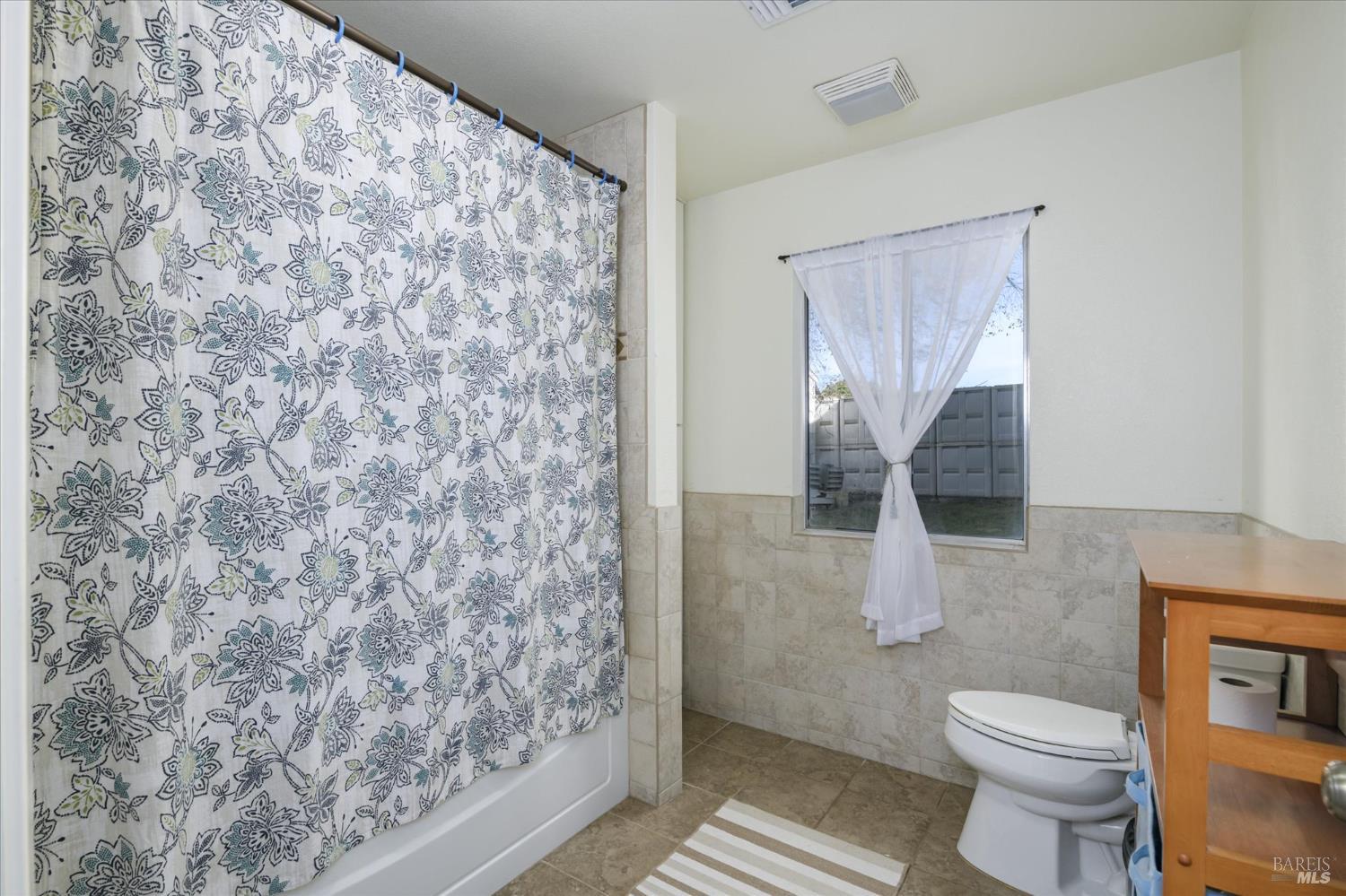 5430 Putah Creek Road Winters, CA 95694 - Photo 54 of 99 a bathroom with a toilet and a shower curtain