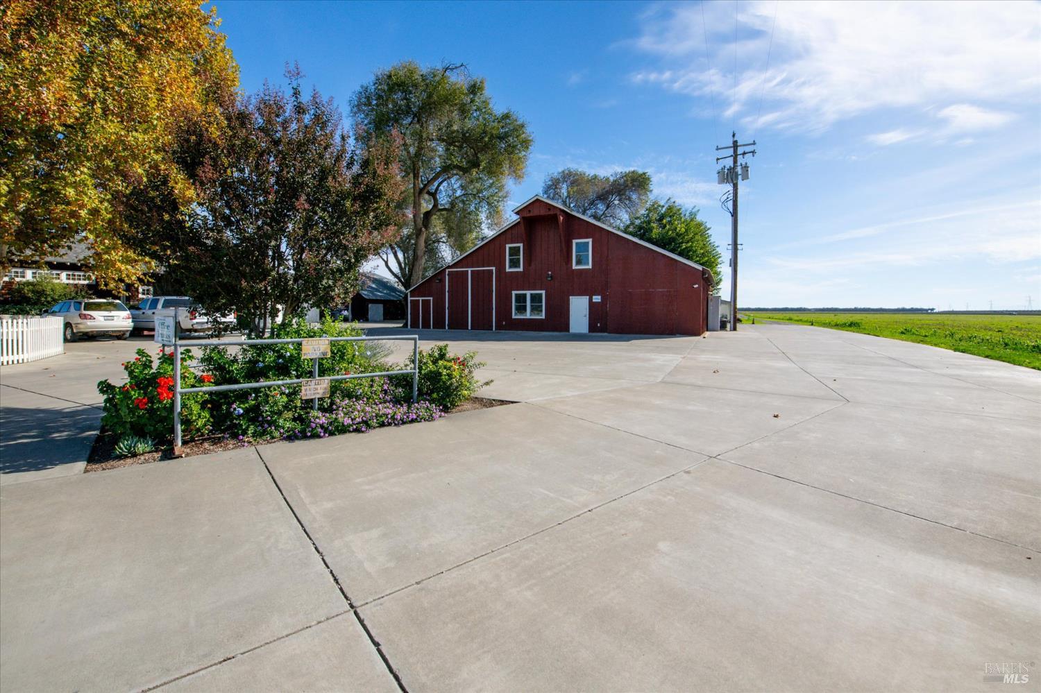 5430 Putah Creek Road Winters, CA 95694 - Photo 56 of 99 a front view of a house with a yard and garage