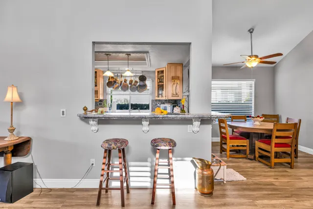 a dining room with furniture and window