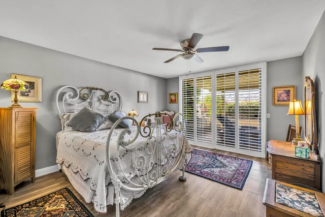 a bed room with furniture and a large window