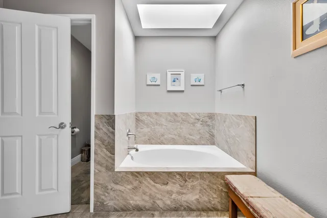 a bathroom with a bathtub and shower
