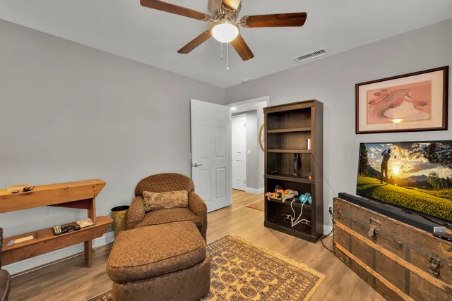 a room with furniture and a flat screen tv