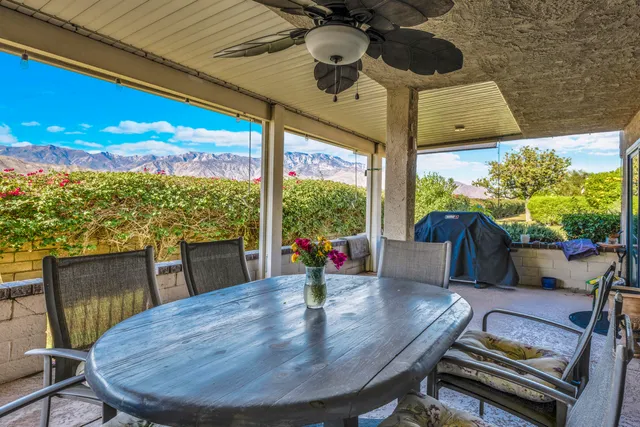 a view of a dining room with furniture window and outside view