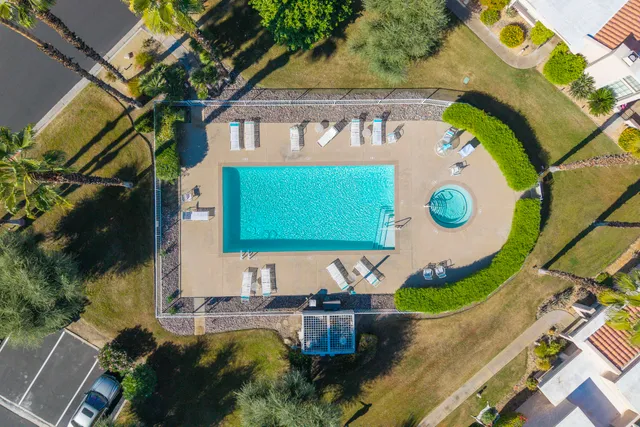 a view of a swimming pool with a patio