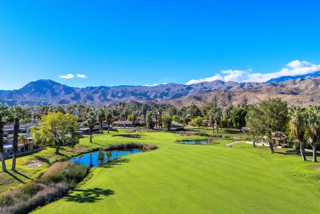a view of swimming pool with outdoor seating