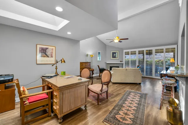 a room with furniture pool table and flat screen tv