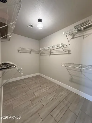 a spacious bathroom with a double vanity sink and a mirror