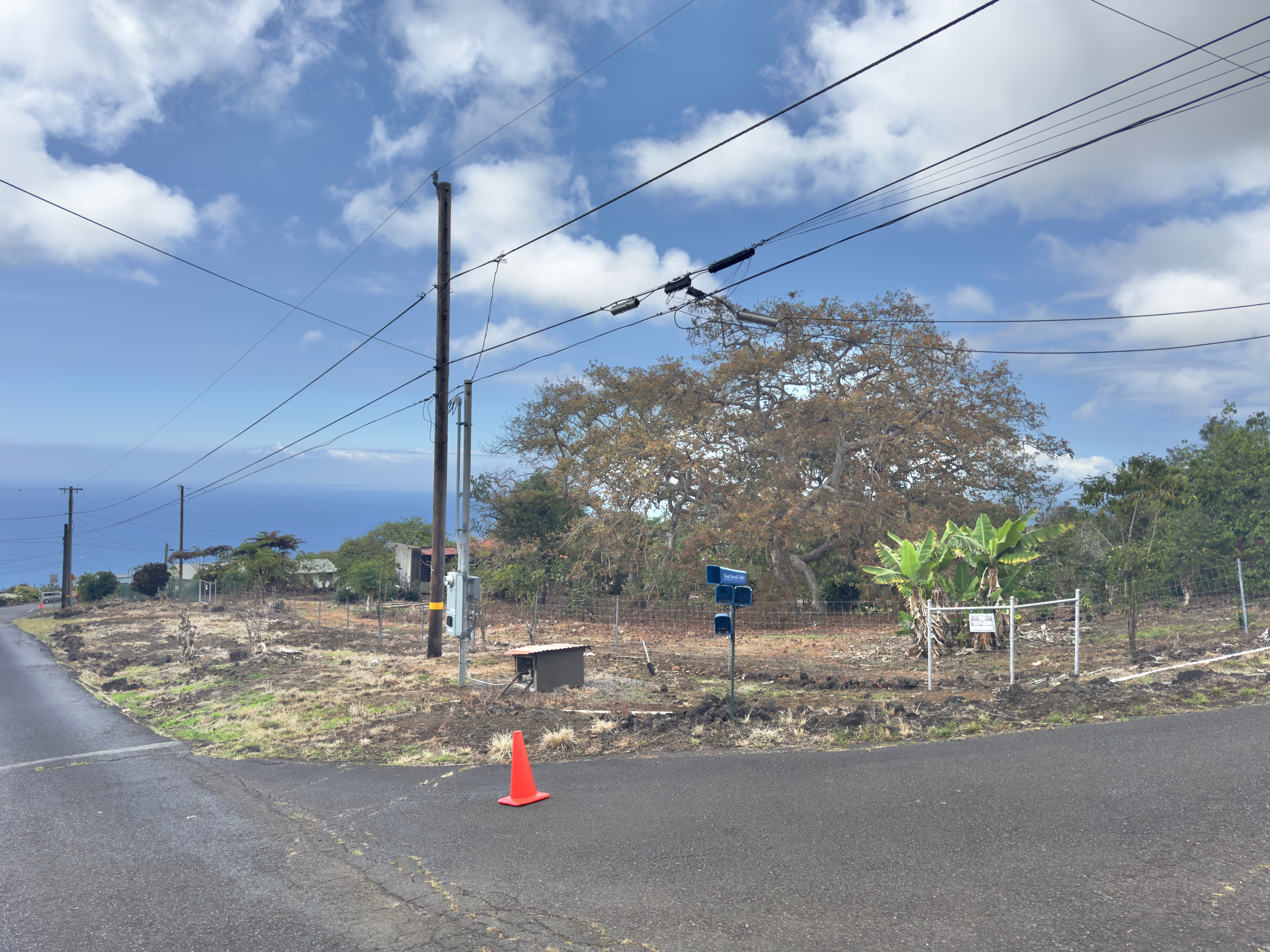 82-1091 Kinue Road Captain Cook, HI 96704 - Photo 20 of 28 a view of a street with houses on the road