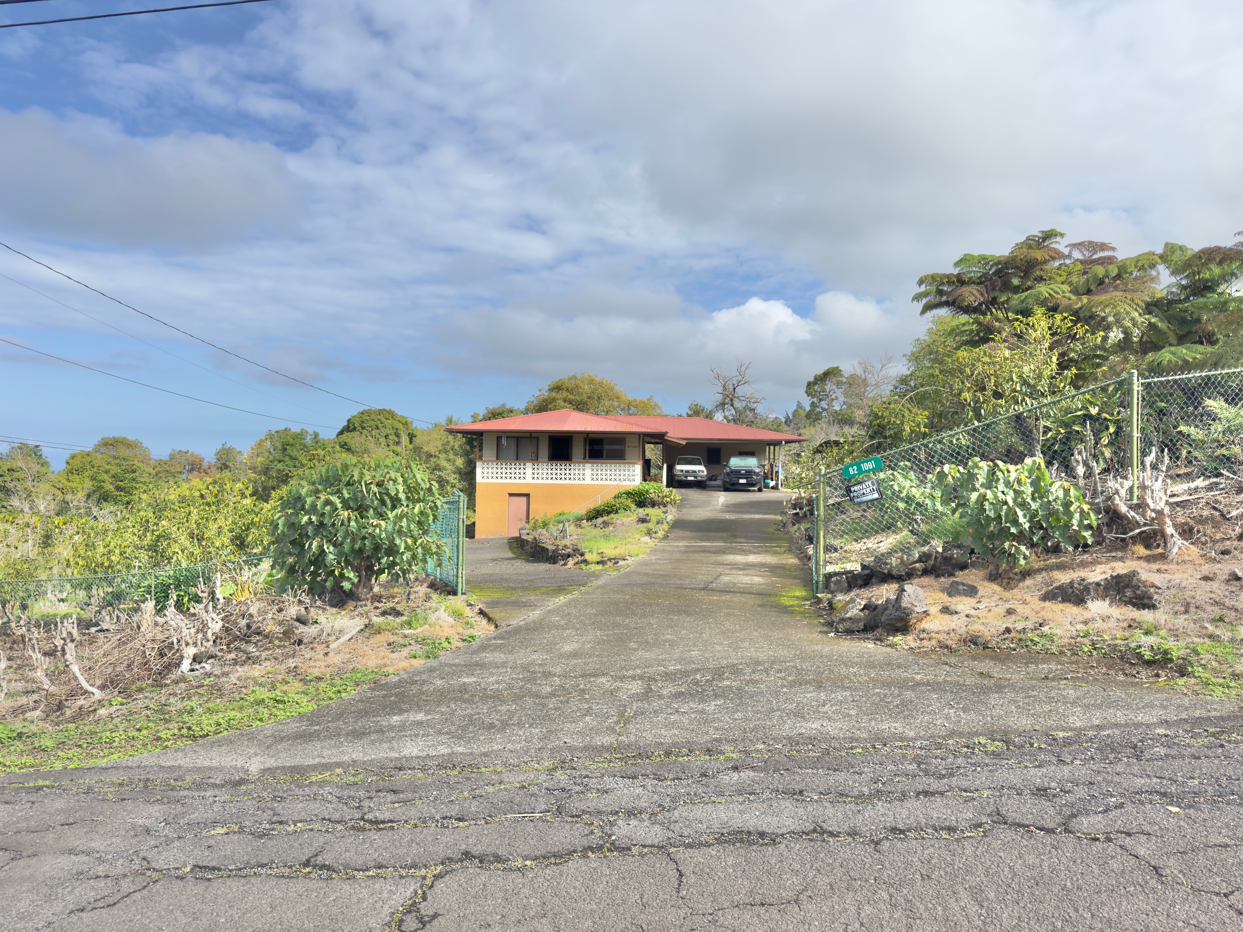 82-1091 Kinue Road Captain Cook, HI 96704 - Photo 2 of 28 a view of a street with some trees