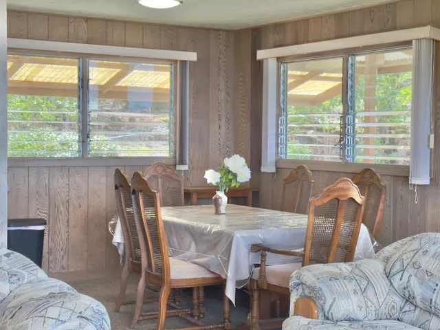 a dining room with furniture and window