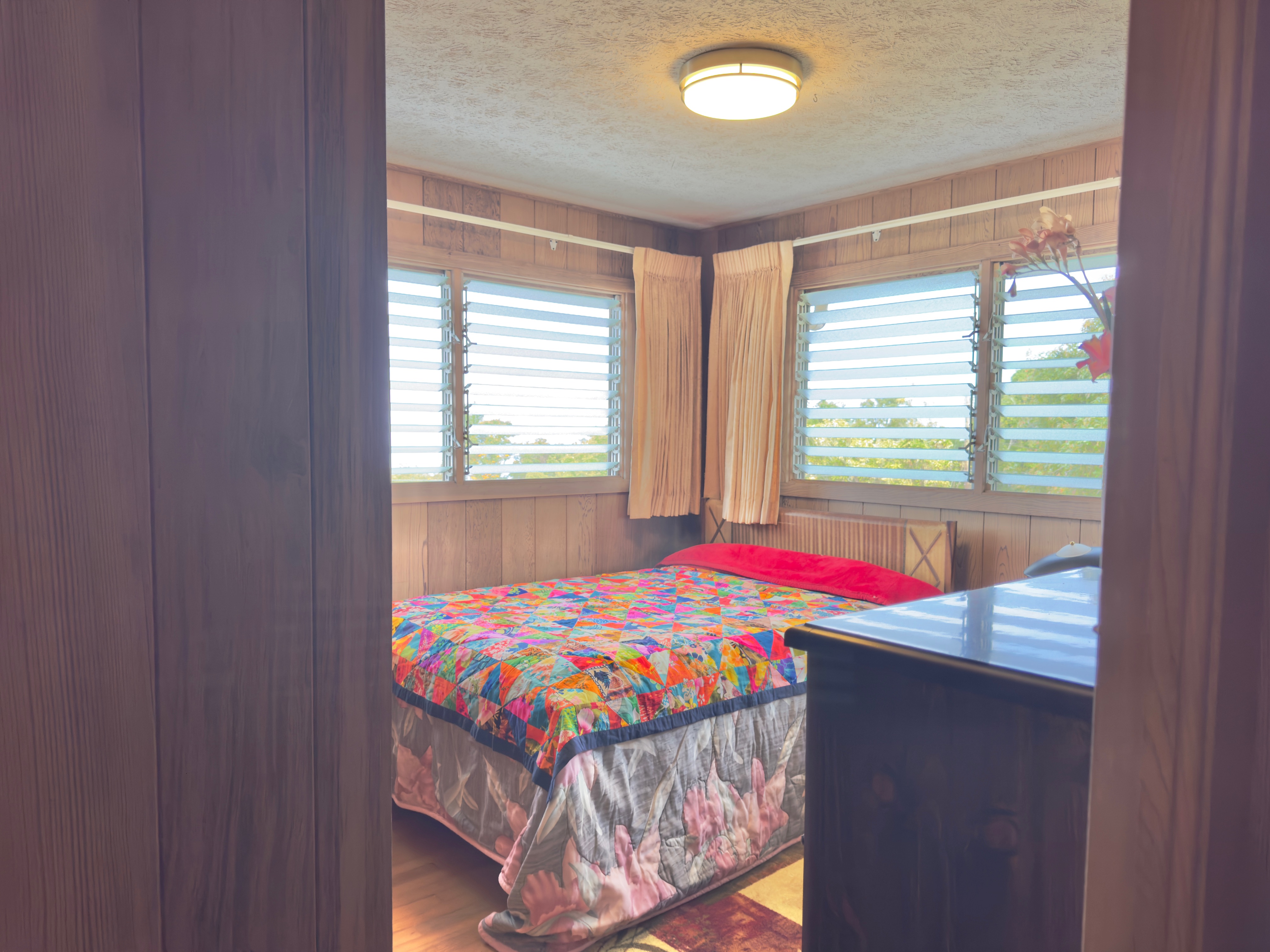 82-1091 Kinue Road Captain Cook, HI 96704 - Photo 10 of 28 a bedroom with a bed and a window