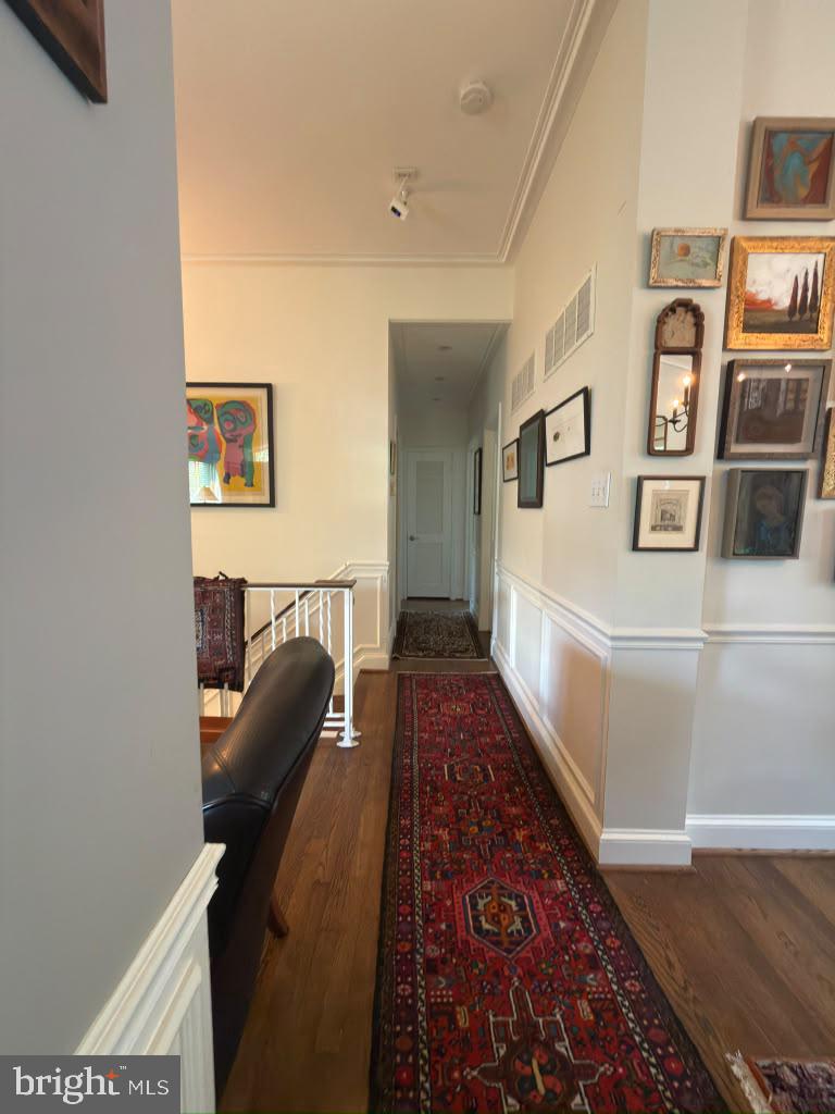 6801 Old Chesterbrook Road McLean, VA 22101 - Photo 11 of 30 Charming hallway with vibrant art.