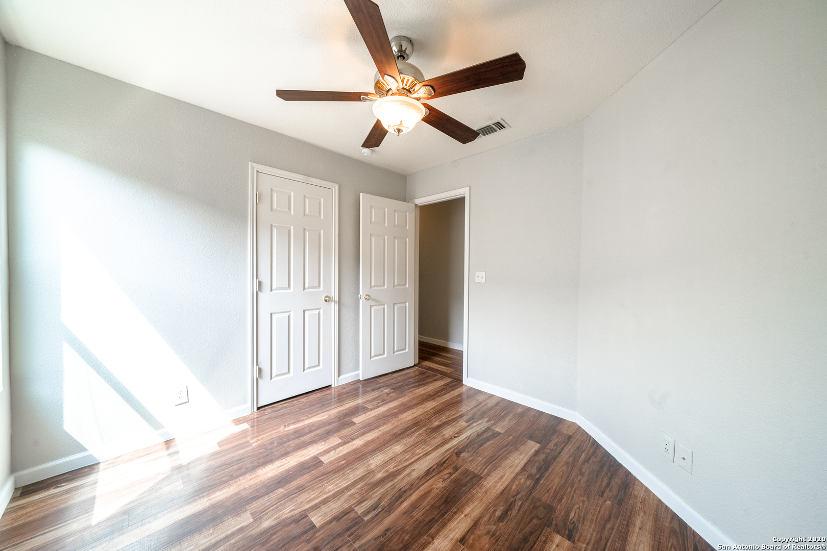 7907 M G Road San Antonio, TX 78251 - Photo 16 of 19 an empty room with closet and ceiling fan