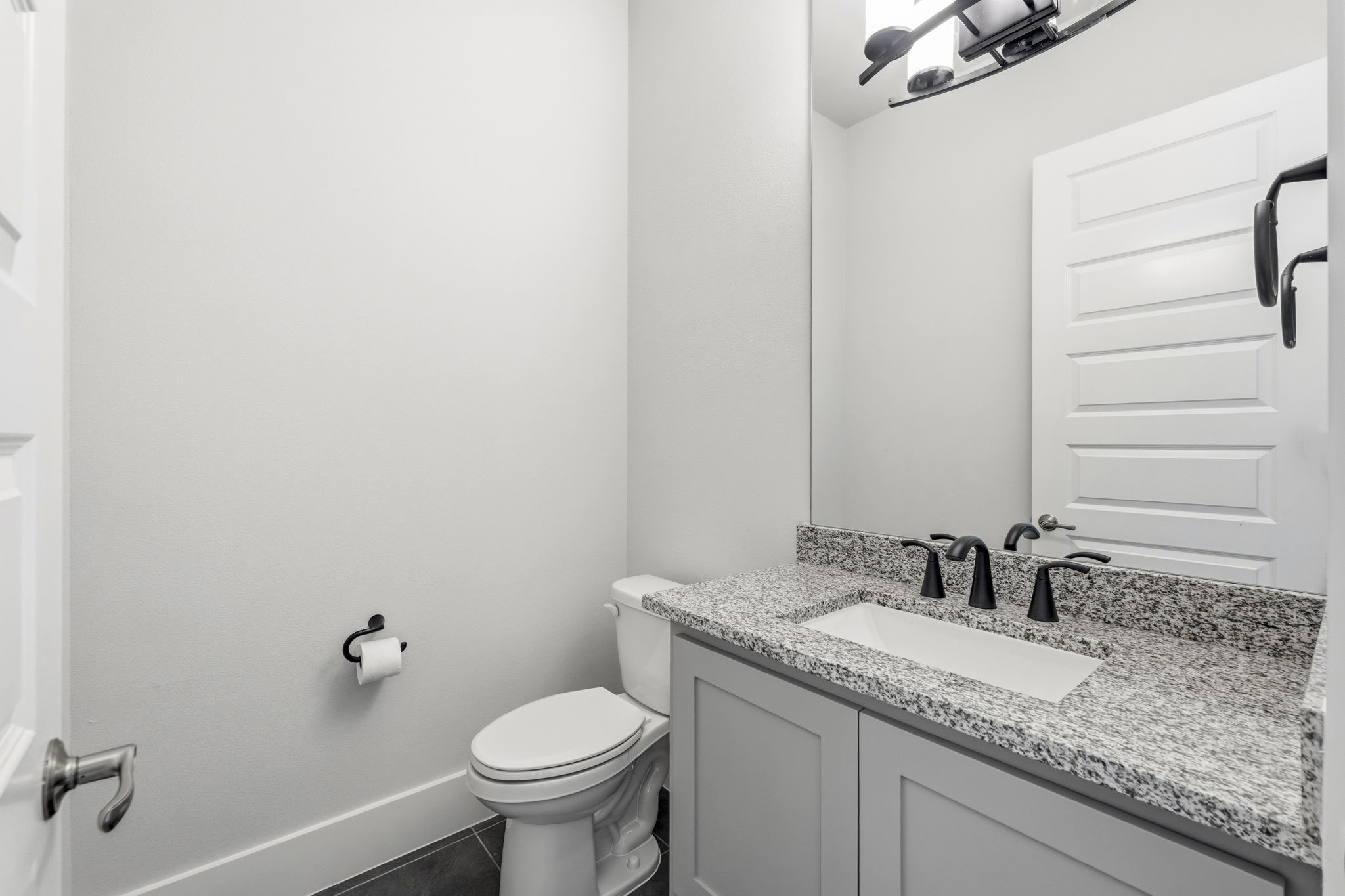 16140 Frst Ml Road Willis, TX 77378 - Photo 27 of 48 Half bath next to game room