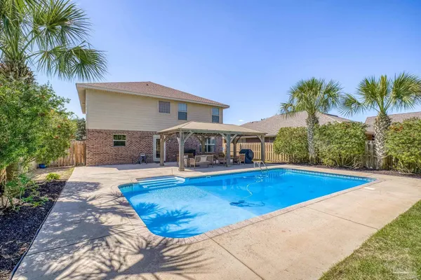 a view of a house with swimming pool