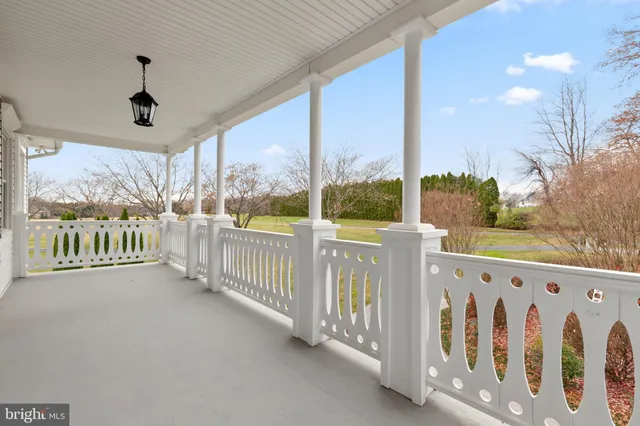 a dining room with furniture a rug and a chandelier