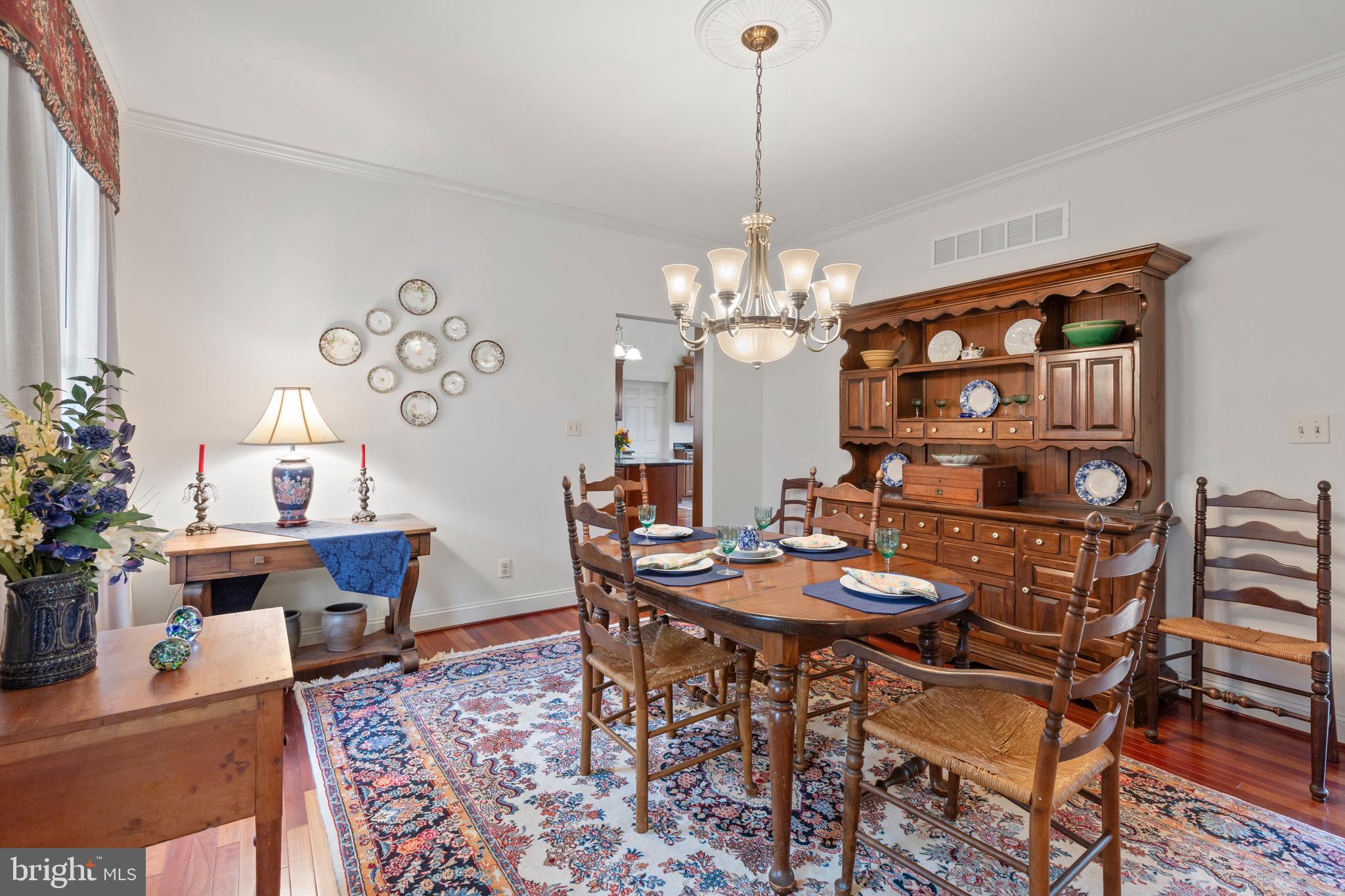 2183 Amoss Mill Road Pylesville, MD 21132 - Photo 18 of 90 a view of a dining room with furniture and chandelier