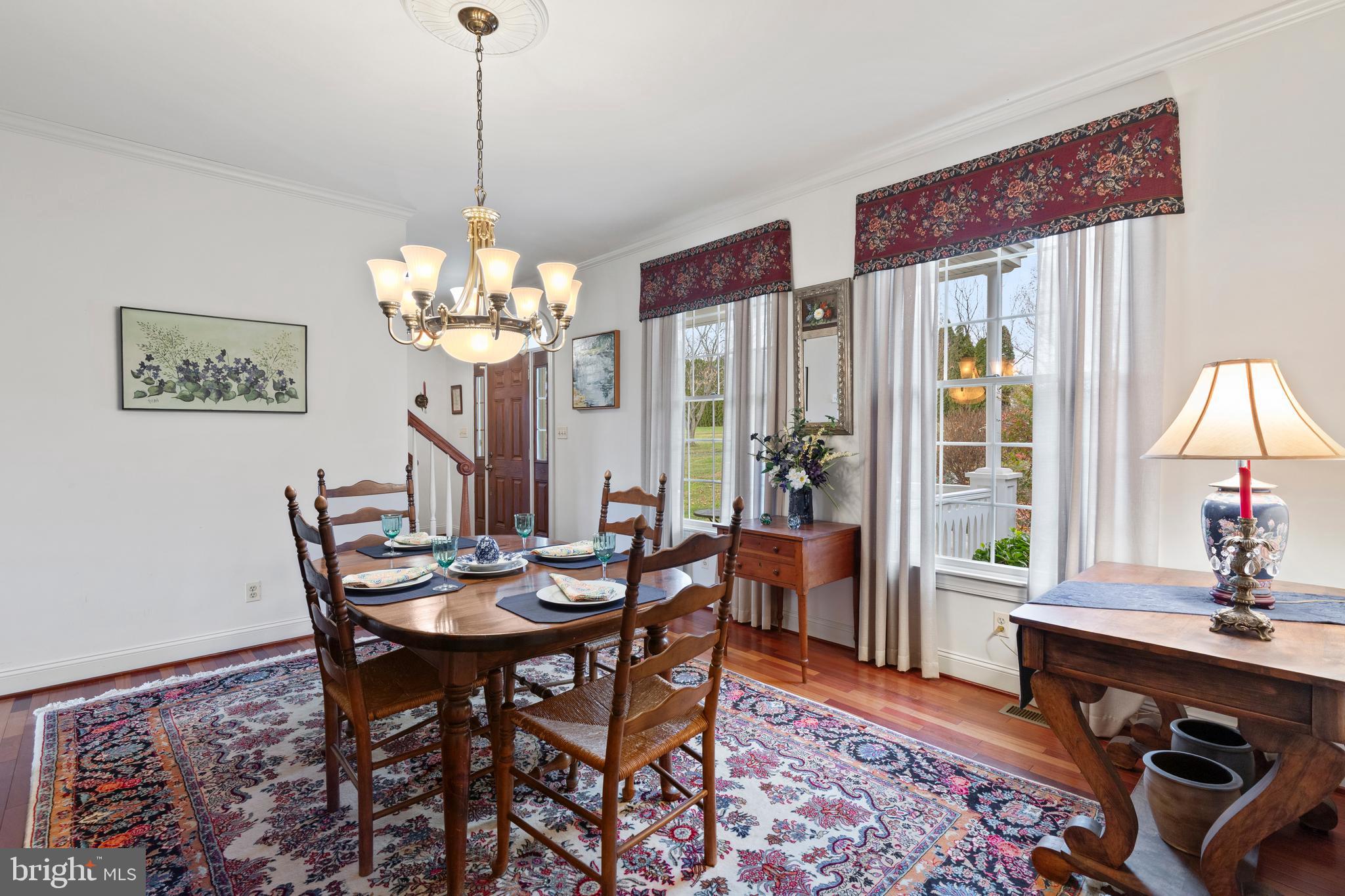 2183 Amoss Mill Road Pylesville, MD 21132 - Photo 20 of 90 a dining room with furniture a rug and a chandelier