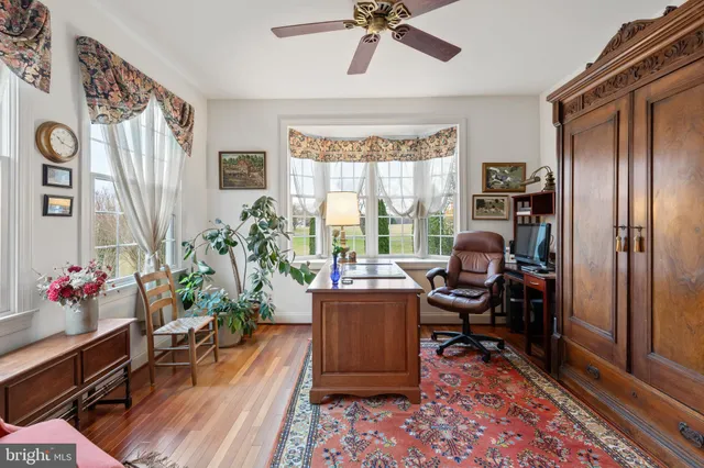 a view of a hallway with workspace and toys