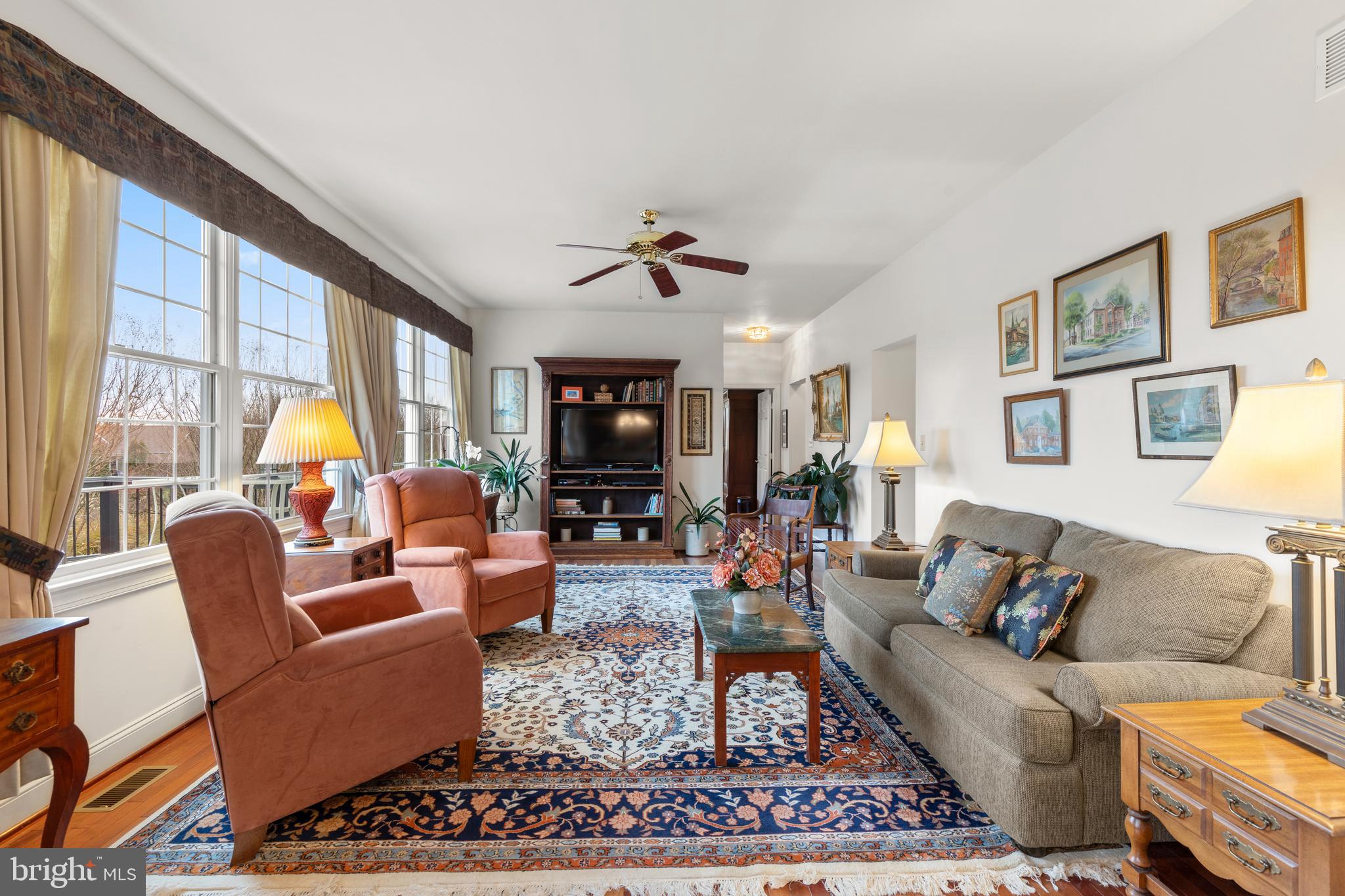 2183 Amoss Mill Road Pylesville, MD 21132 - Photo 24 of 90 a living room with furniture a rug and a flat screen tv