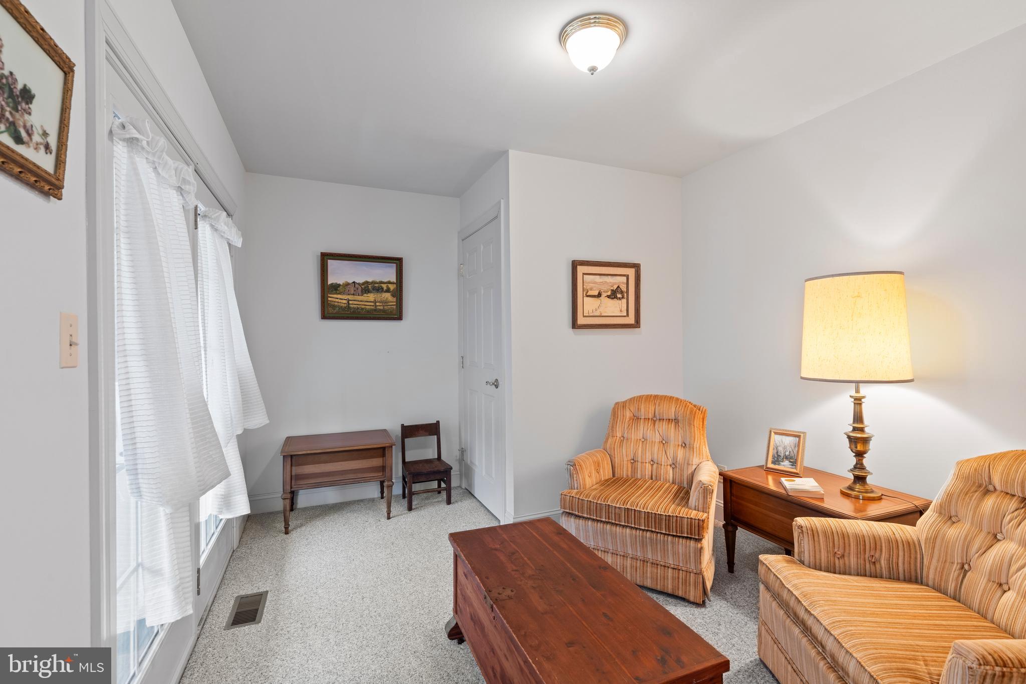 2183 Amoss Mill Road Pylesville, MD 21132 - Photo 38 of 90 a living room with furniture and a lamp