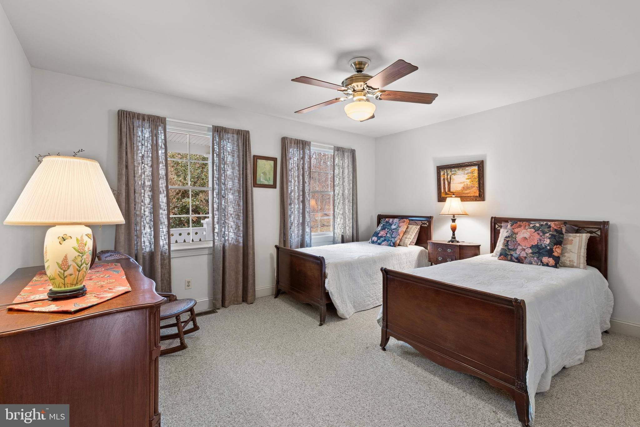 2183 Amoss Mill Road Pylesville, MD 21132 - Photo 43 of 90 a bedroom with a bed and a chandelier