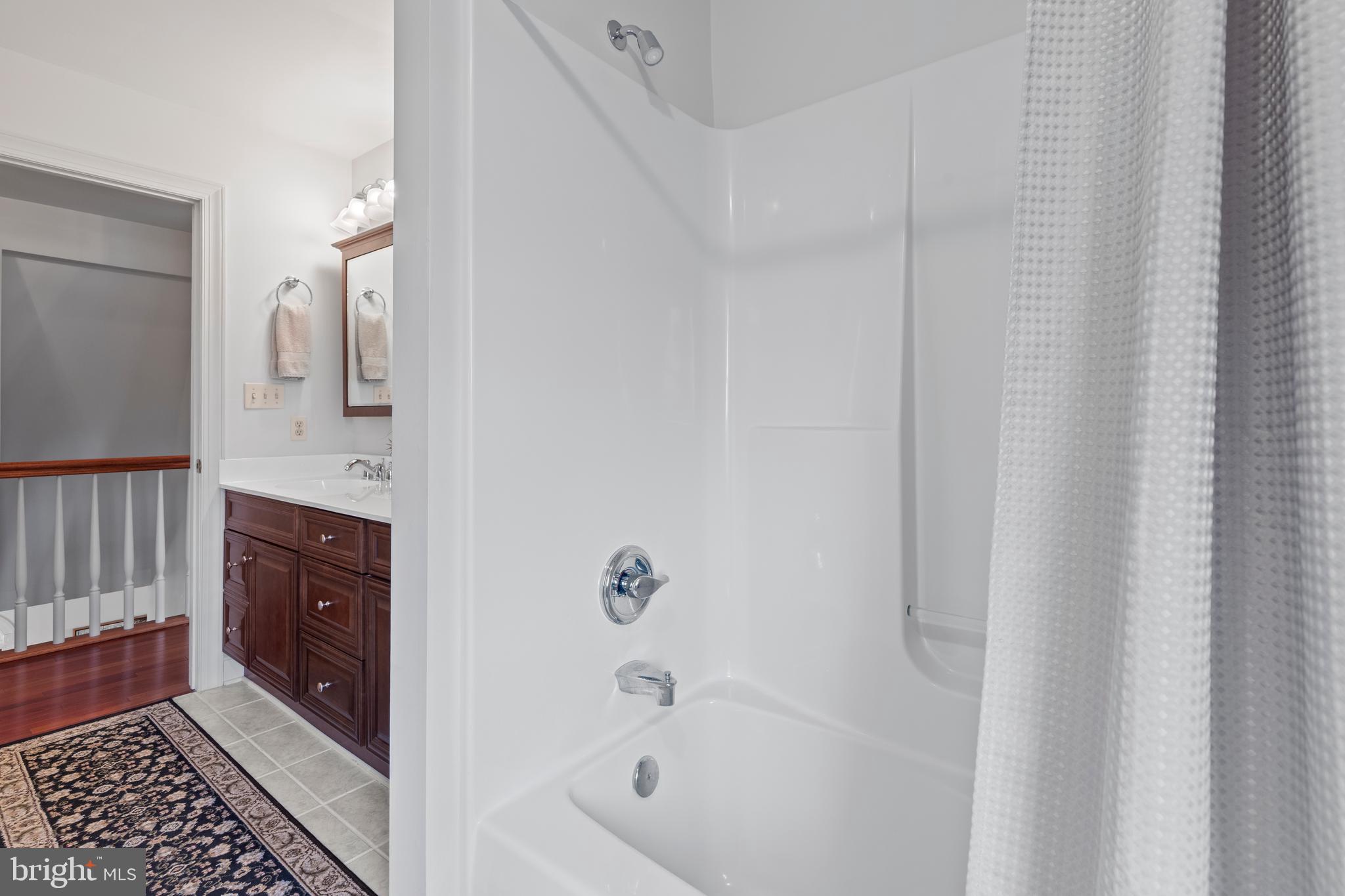 2183 Amoss Mill Road Pylesville, MD 21132 - Photo 48 of 90 a bathroom with a bathtub a sink and a mirror