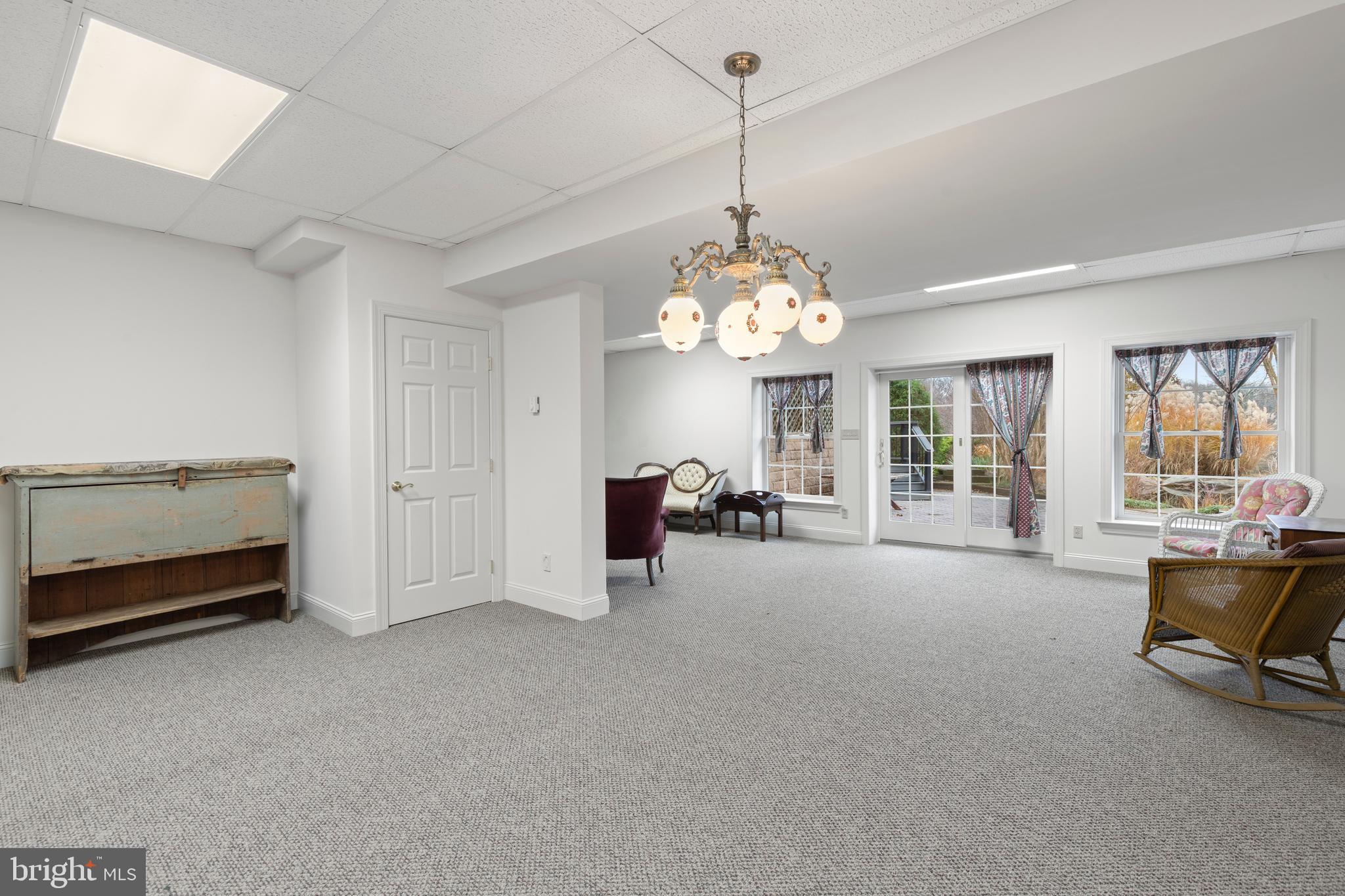 2183 Amoss Mill Road Pylesville, MD 21132 - Photo 49 of 90 a view of a livingroom with furniture a chandelier and window