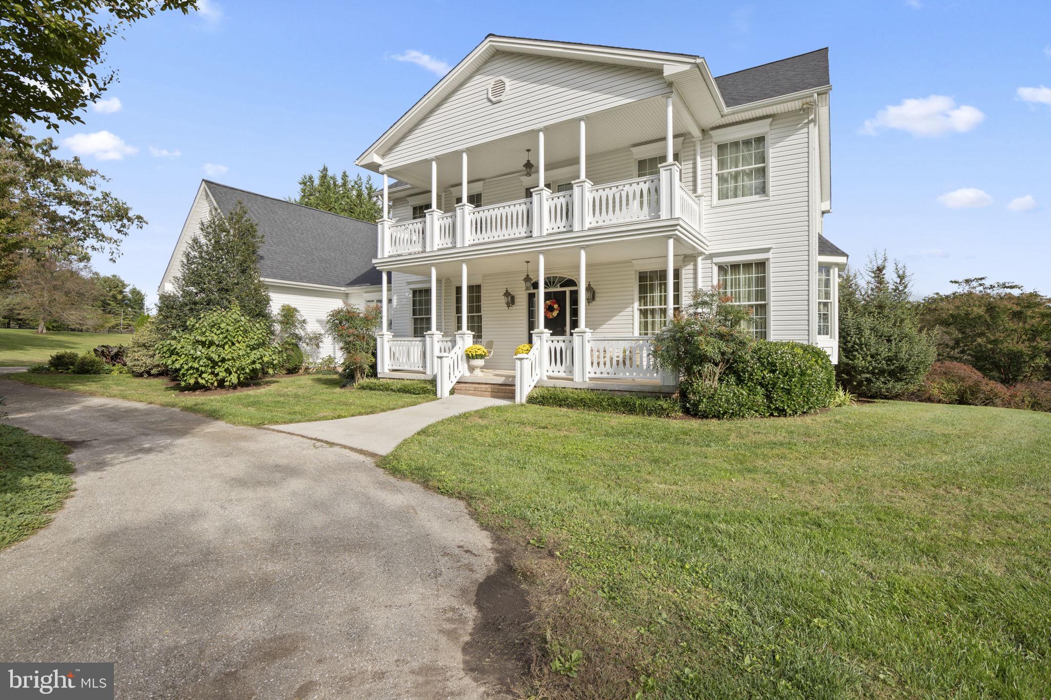 2183 Amoss Mill Road Pylesville, MD 21132 - Photo 6 of 90 a front view of a house with a yard and trees