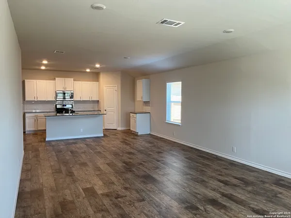 a view of kitchen with wooden floor