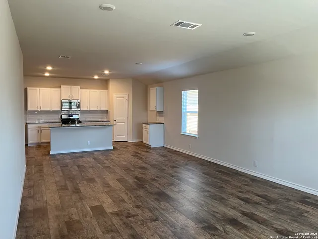 a view of kitchen with wooden floor