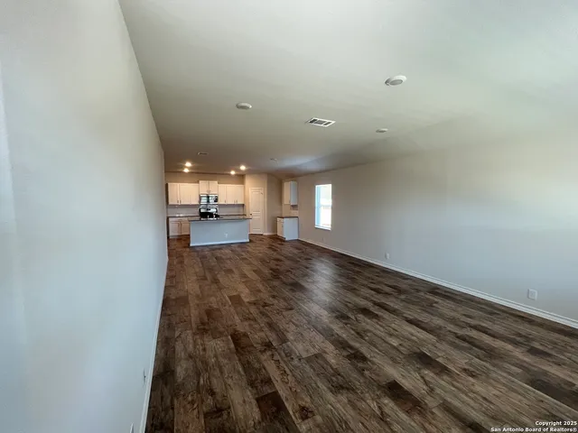 a view of livingroom and hardwood floor
