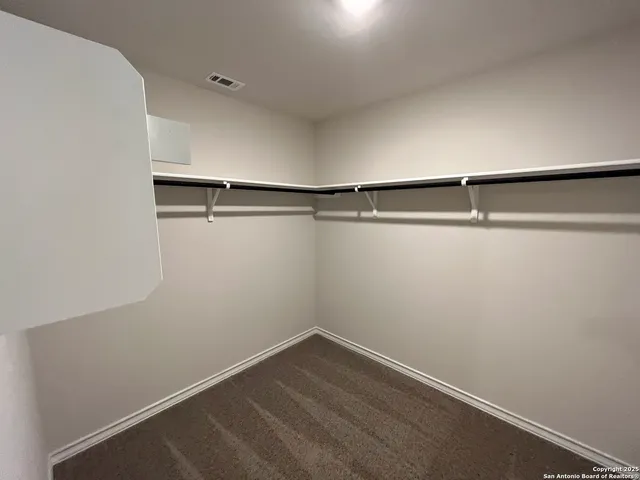 a view of a room with racks on the wall