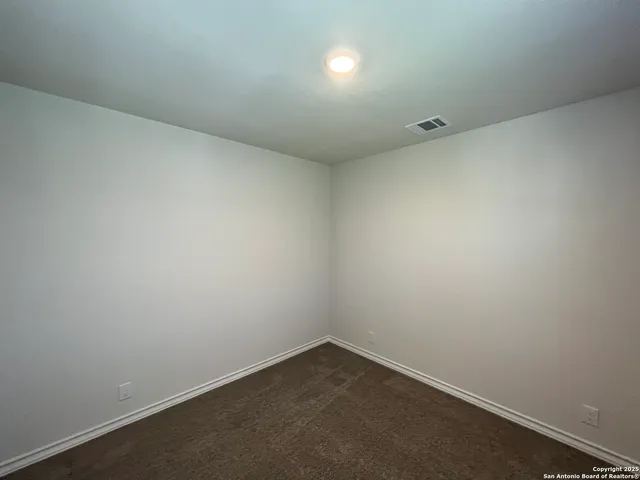 an empty room with a empty space and window