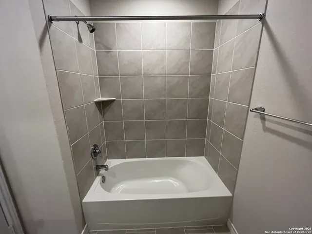 a bathroom with a bath tub