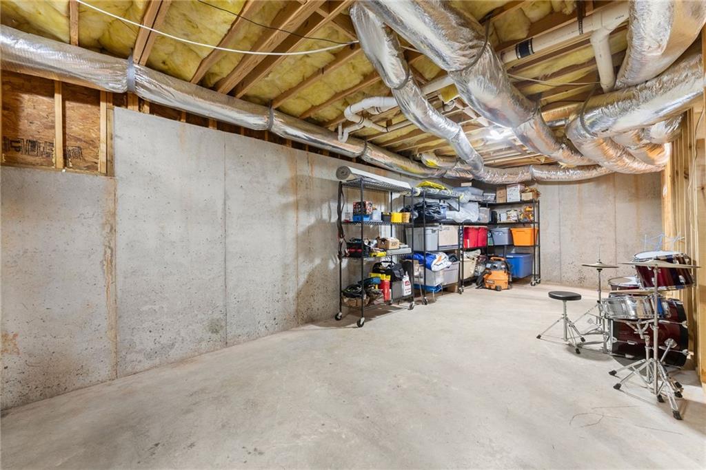 6643 Windvane Point Clermont, GA 30527 - Photo 53 of 88 a view of a garage with a bike and wooden roof