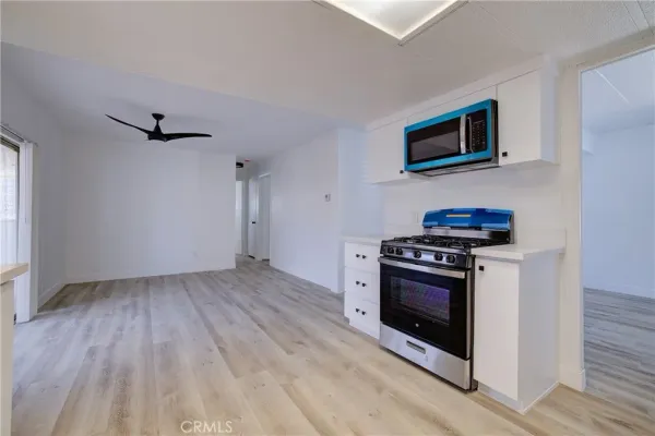 a kitchen with a stove and a microwave
