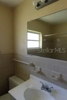 a bathroom with a sink and a toilet