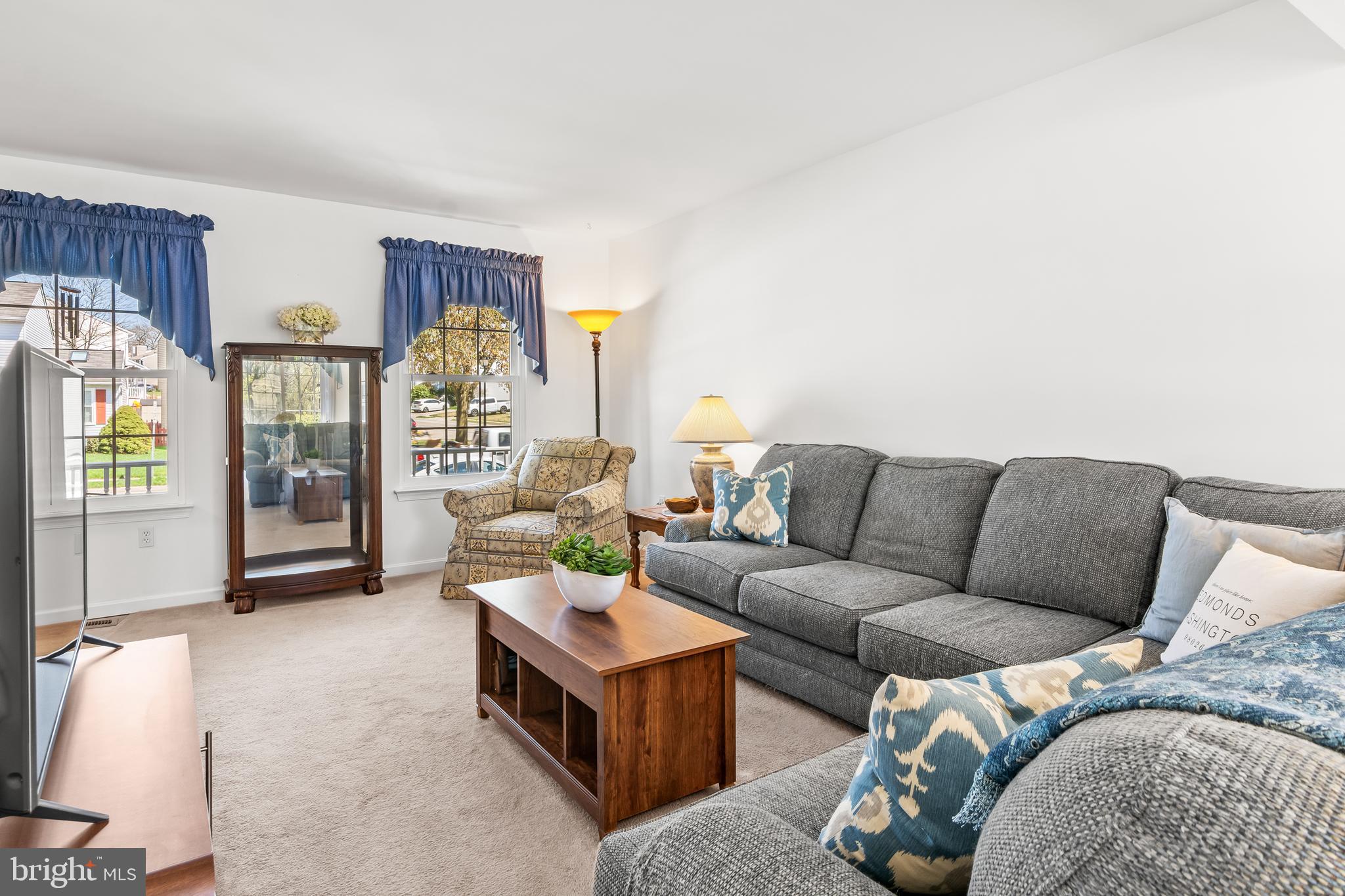 7866 Kings Bench Place Pasadena, MD 21122 - Photo 13 of 51 a living room with furniture and a large window