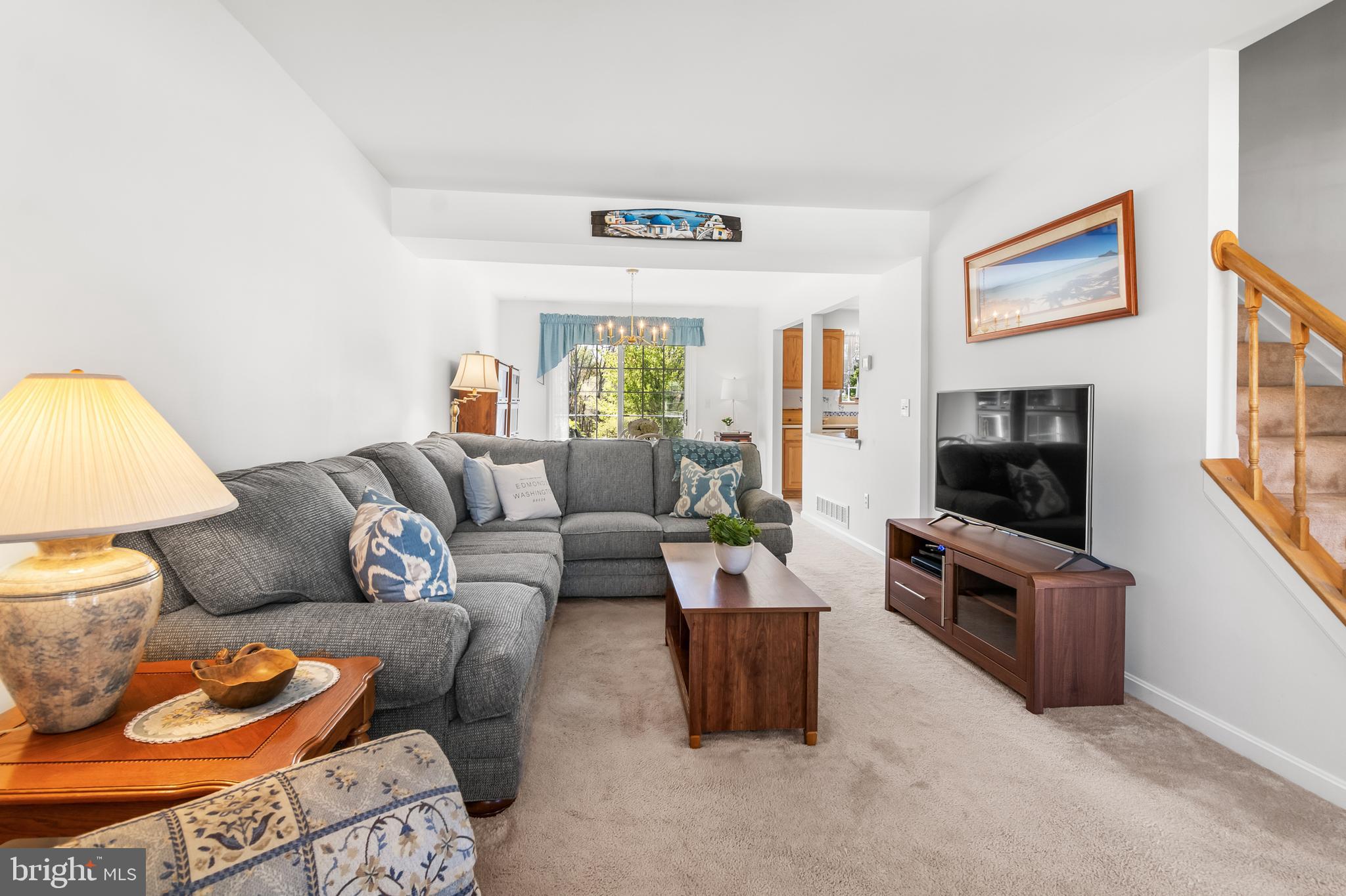 7866 Kings Bench Place Pasadena, MD 21122 - Photo 15 of 51 a living room with furniture and a flat screen tv